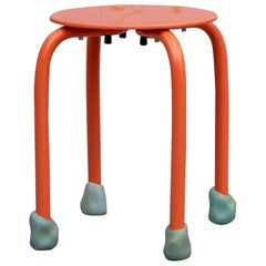 Yareta Orange Stool with Sculptural Rubber Feet – Modern Stackable Design