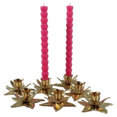 Set of 7 flower-shaped candlesticks in shiny heavy brass, 1970-1980