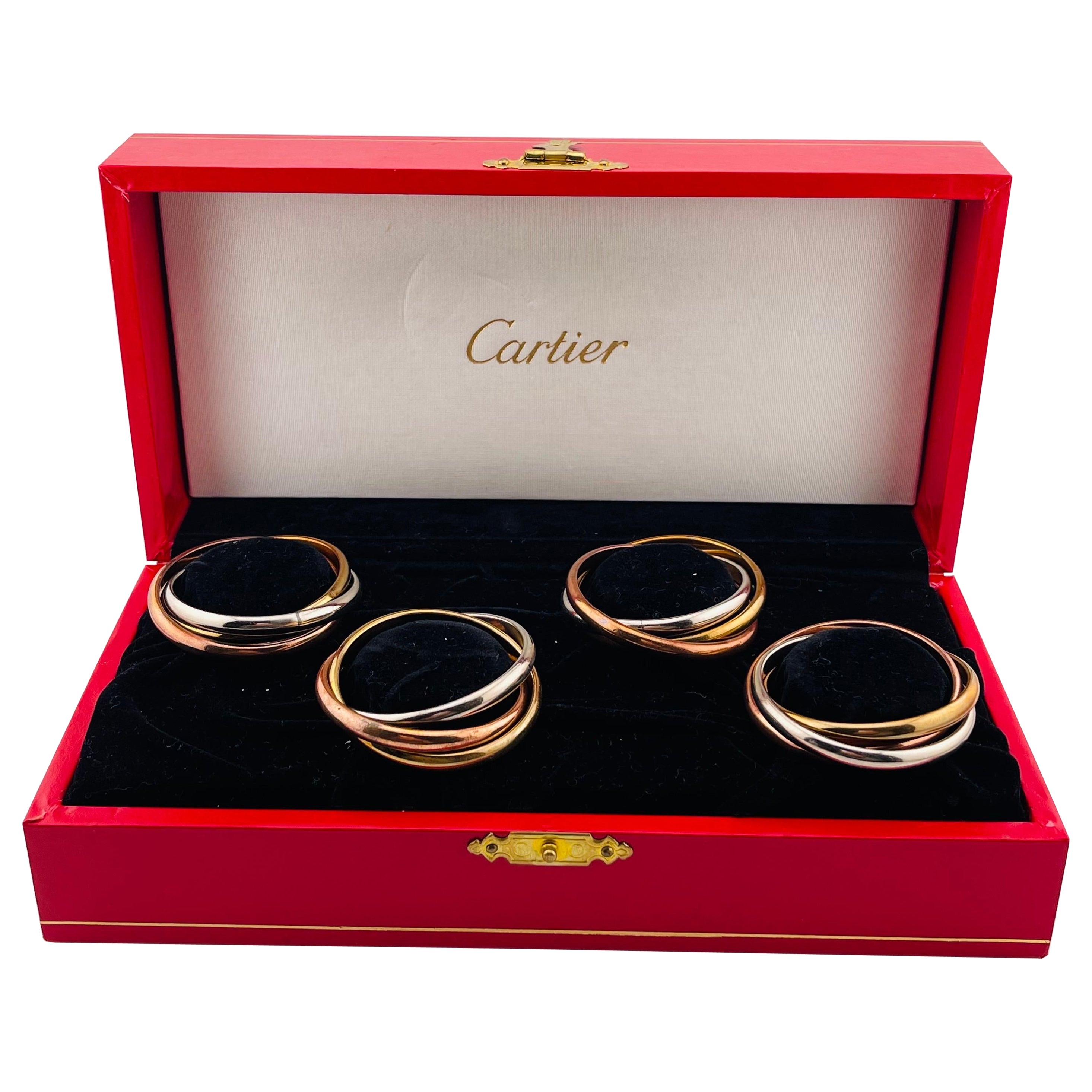 CARTIER napkin rings with box, 4 pieces, "Trinity."