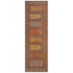 Suspension murale traditionnelle ancienne en laine rouge de Khotan, fabriquée à la main