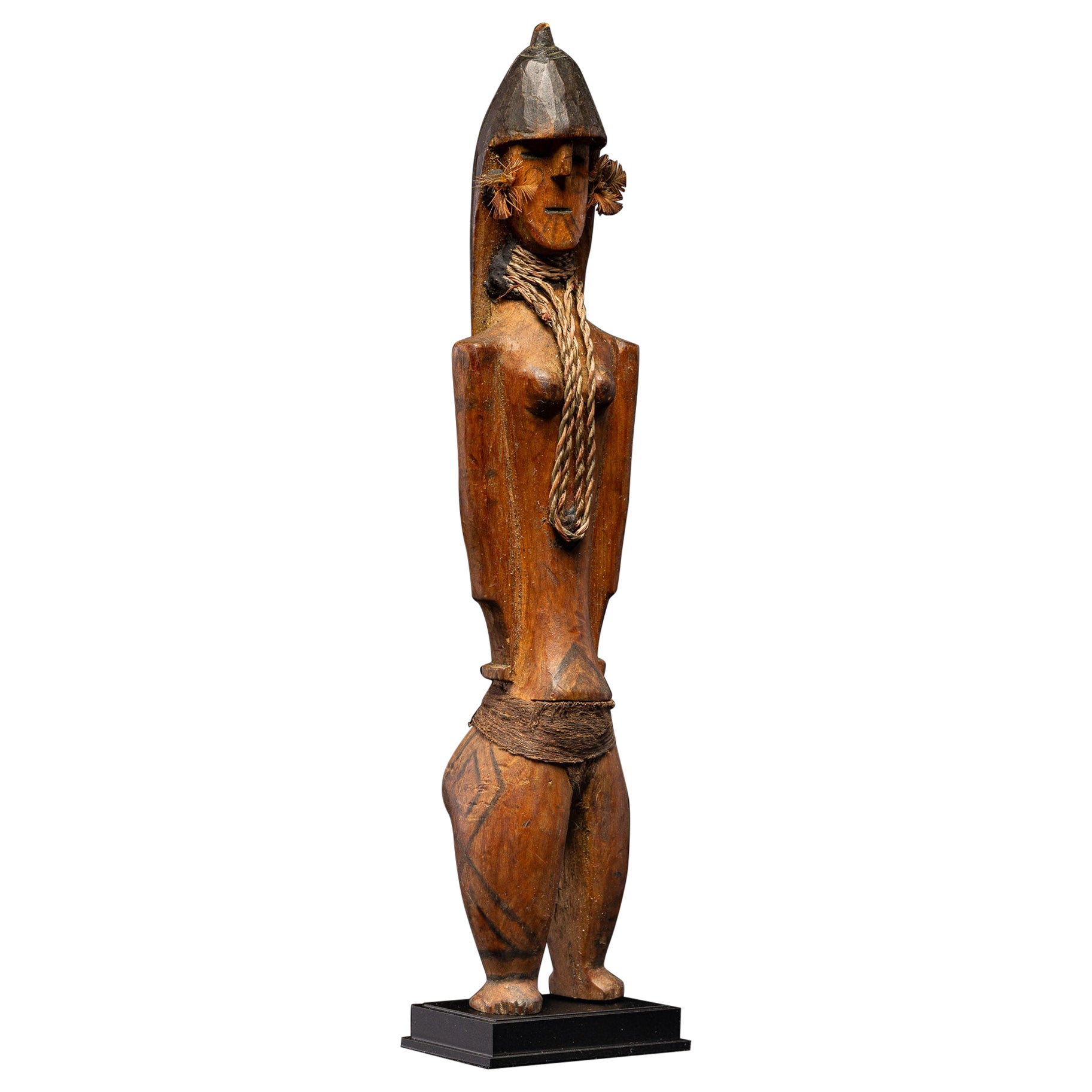 Rara muñeca Karaja ceremonial de madera con círculos distintivos en la cara, Brasil