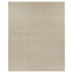 Rug & Kilim è un tappeto oversize in stile scandinavo, con motivi geometrici beige e arancioni.