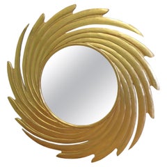 Grand miroir doré en forme de tourbillon en forme de soleil  Une superbe pièce