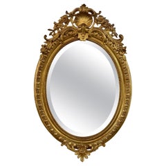19th Century French Louis XVI Oval Carved and Giltwood Mirror