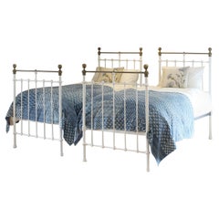 Matching Pair of Antique Cast Iron Antique Beds in White MP68