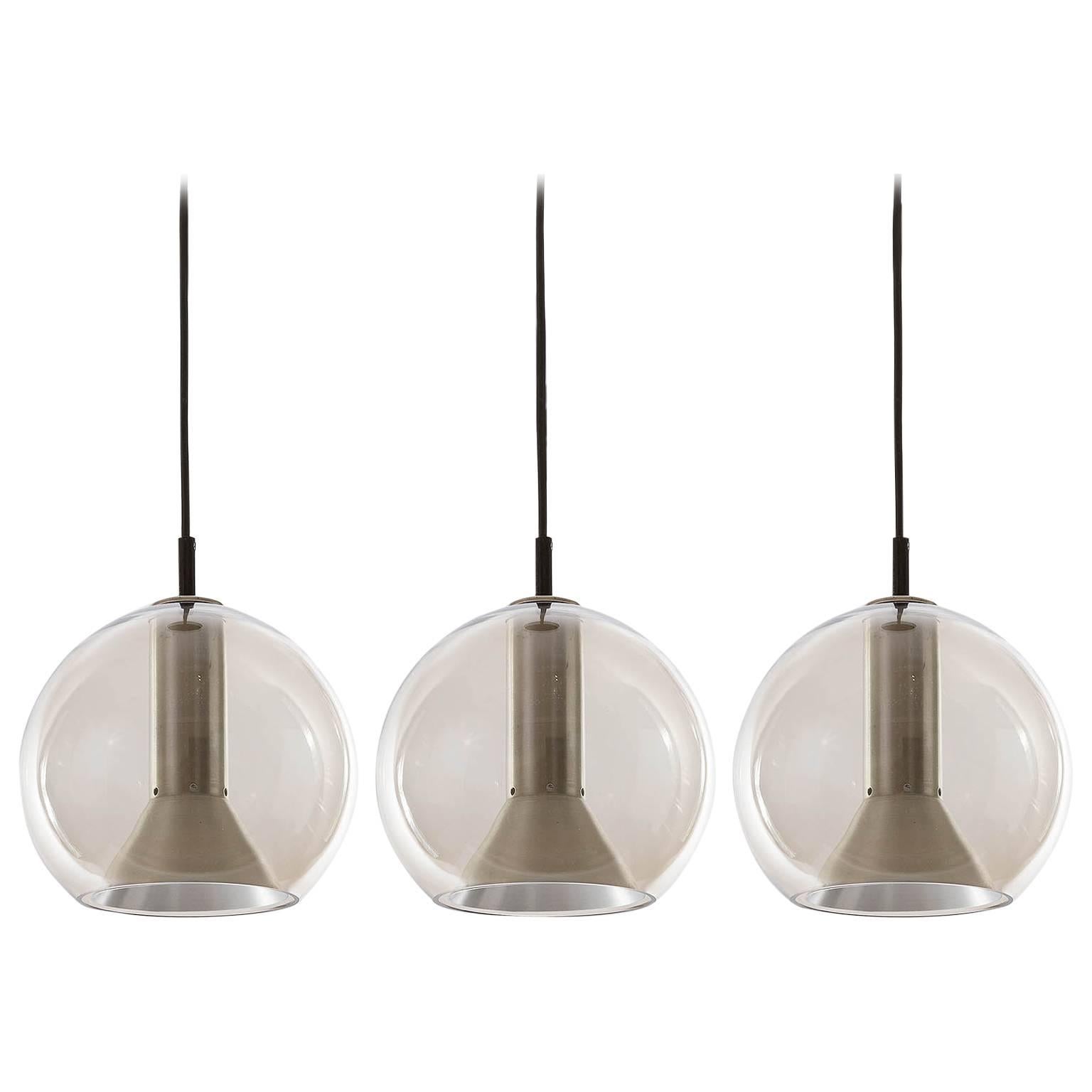 Three RAAK Pendant Lights by Frank Ligtelijn, Smoked Glass Globes, 1960s