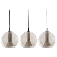 Three RAAK Pendant Lights by Frank Ligtelijn, Smoked Glass Globes, 1960s