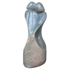 1970s Hand-carved Abstract Sculpture in Greenish Marble of an Embracing Couple
