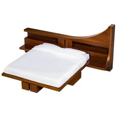 Cama de matrimonio Vela de Ferdinando Meccani en nogal