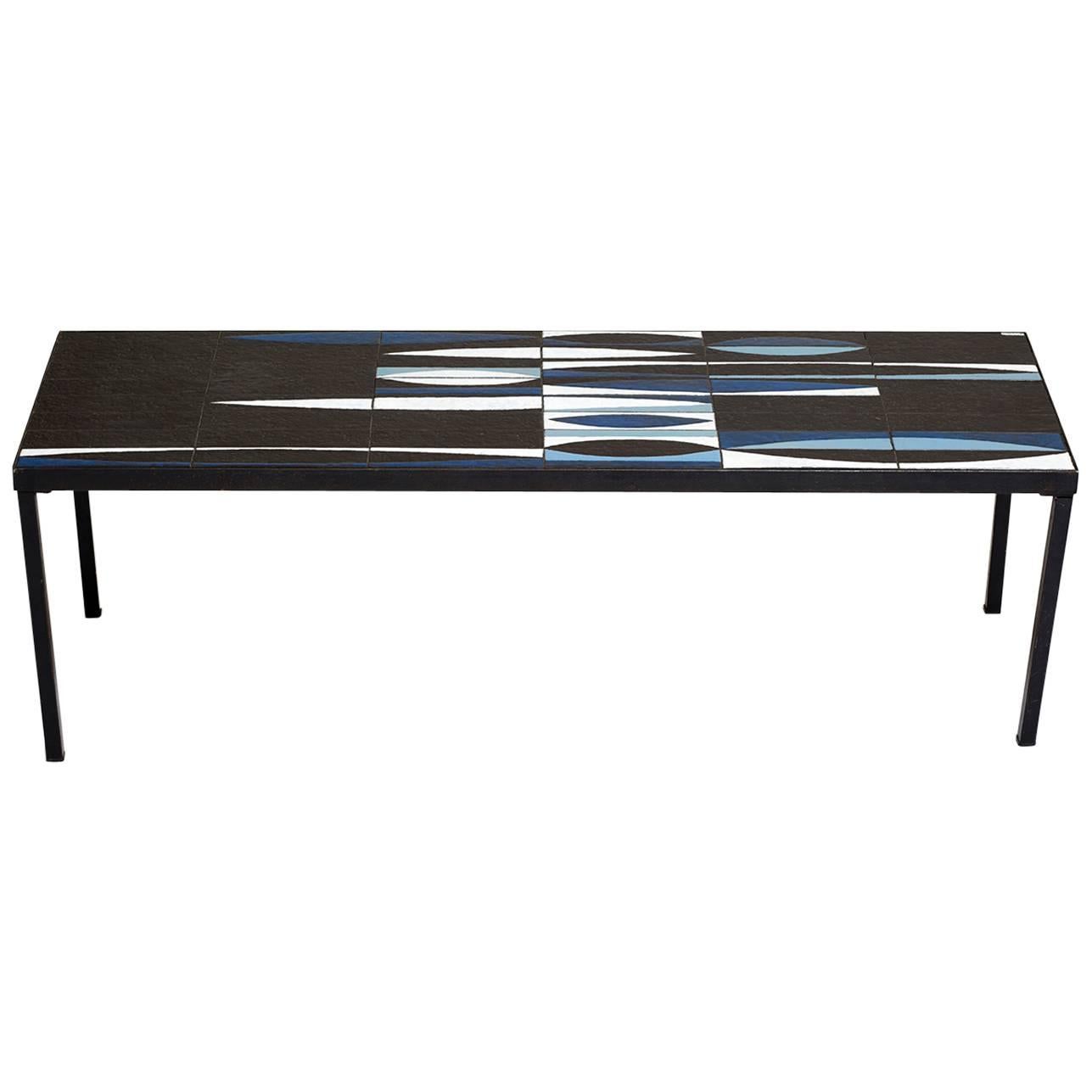Capron Blue Black  Ceramic Navette Coffee Table, Iron 1950 France Mid Century

Very Rare blue Roger Capron Navette ceramic table
signed by Artist. This must have been a custom order as it is very rare to find this color