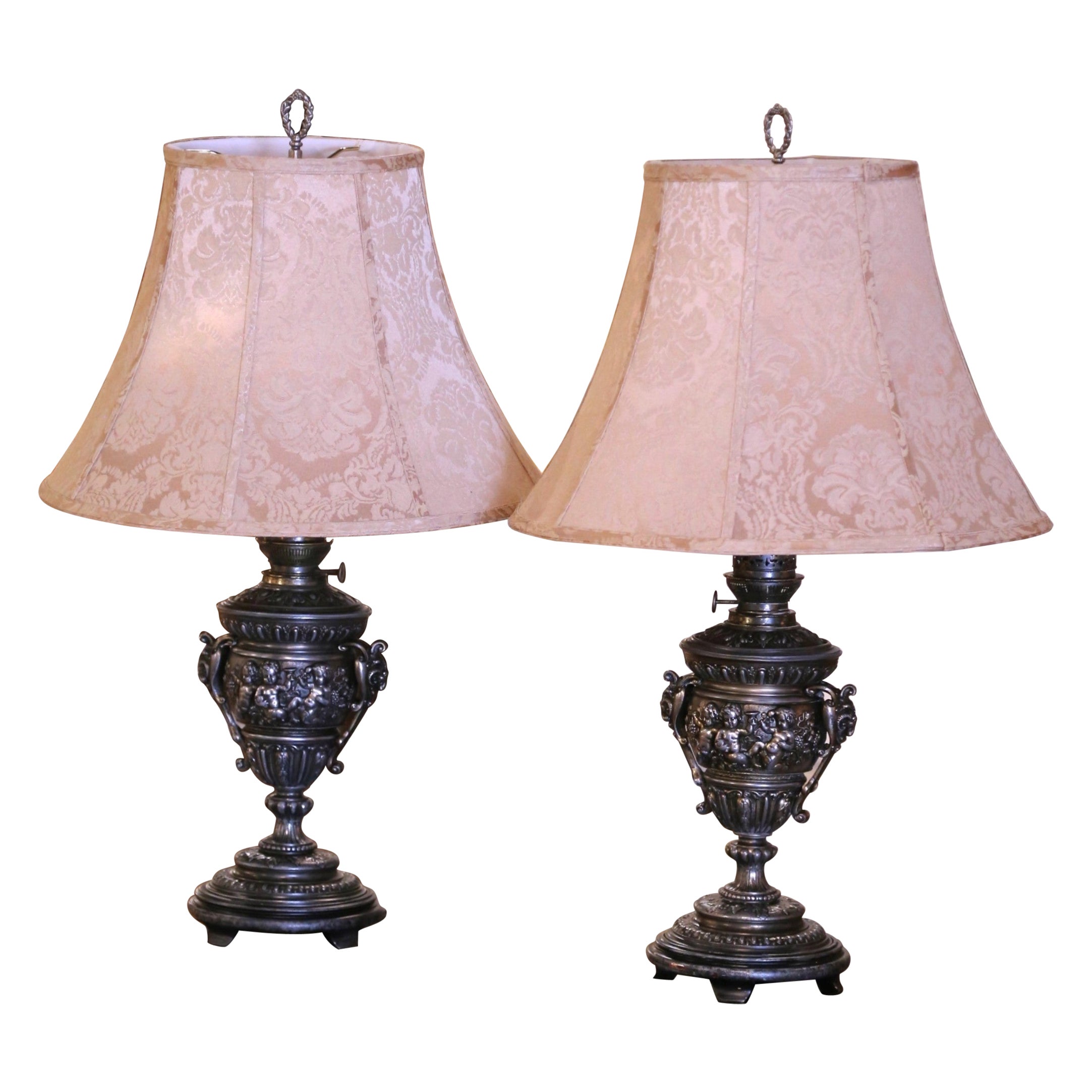 Pair of 19th Century French Polished Repousse Urn-Shaped Table Oil Lamps