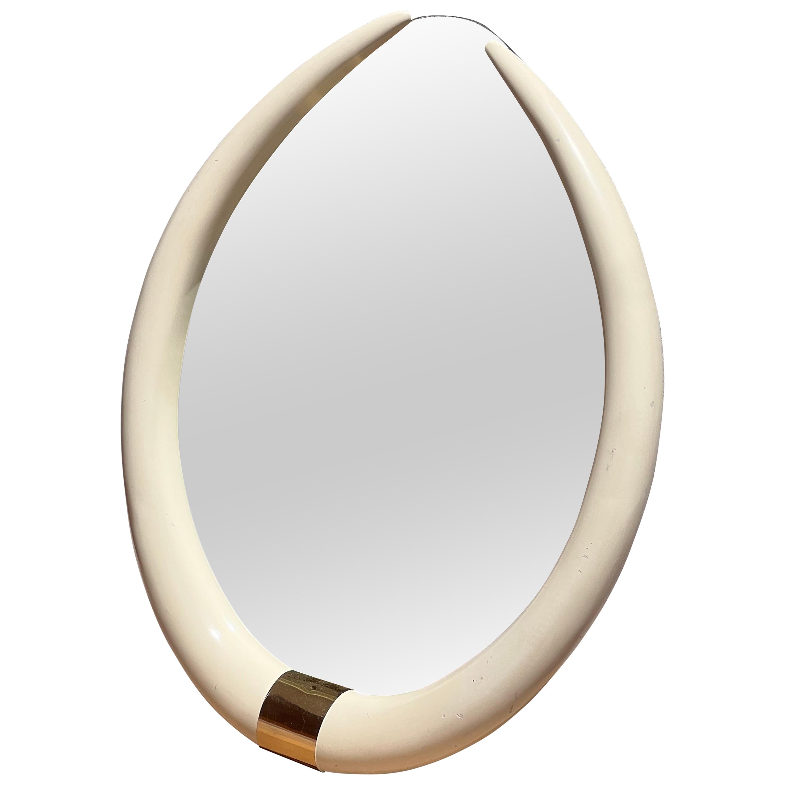 A vintage “elephant tusk” mirror after Karl Springer, circa 1979
