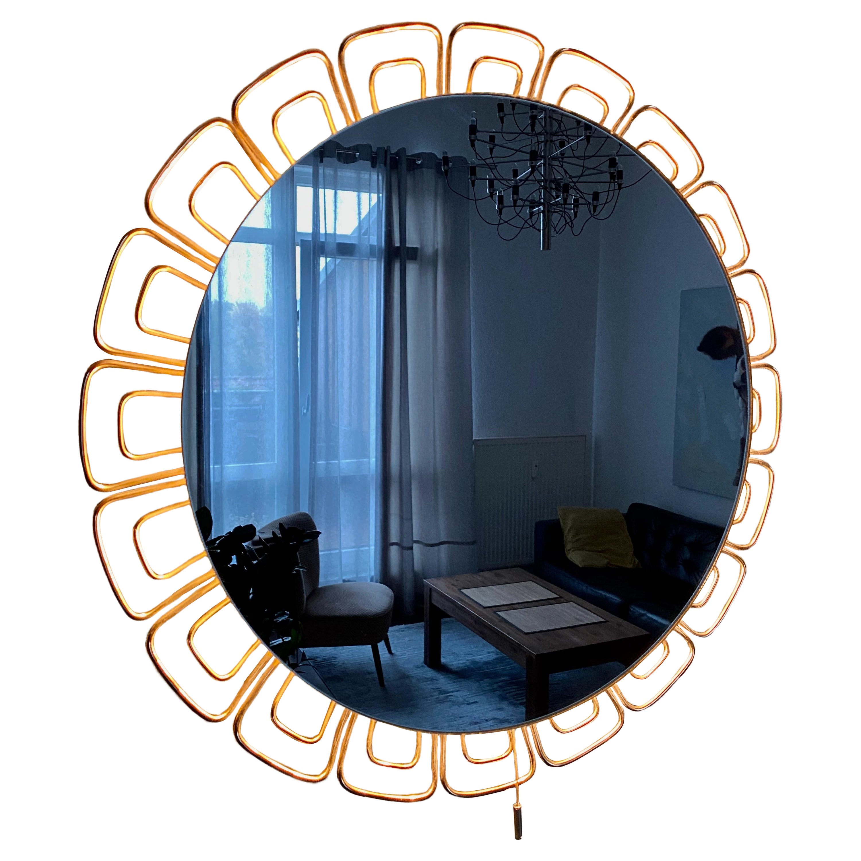 A wall mirror with indirect lighting from the German manufacturer Hillebrand Lighting. It was manufactured in the 1970s. The frame contains four E14 light bulbs (max. 40W). The mirror frame and base are made of metal.
This vintage item is fully