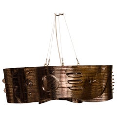 Lustre Curve  par Olivia Cognet avec glaçure argentée