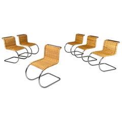 Italian modern chairs in woven straw and curved steel, 1970s