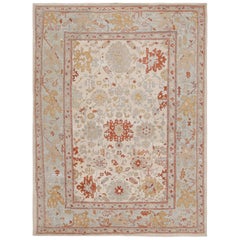 Rug & Kilim’s Oushak Style Rug In Blue, Beige and Red with Floral Pattern