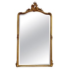 Grand miroir rococo biseauté en bois doré du XIXe siècle