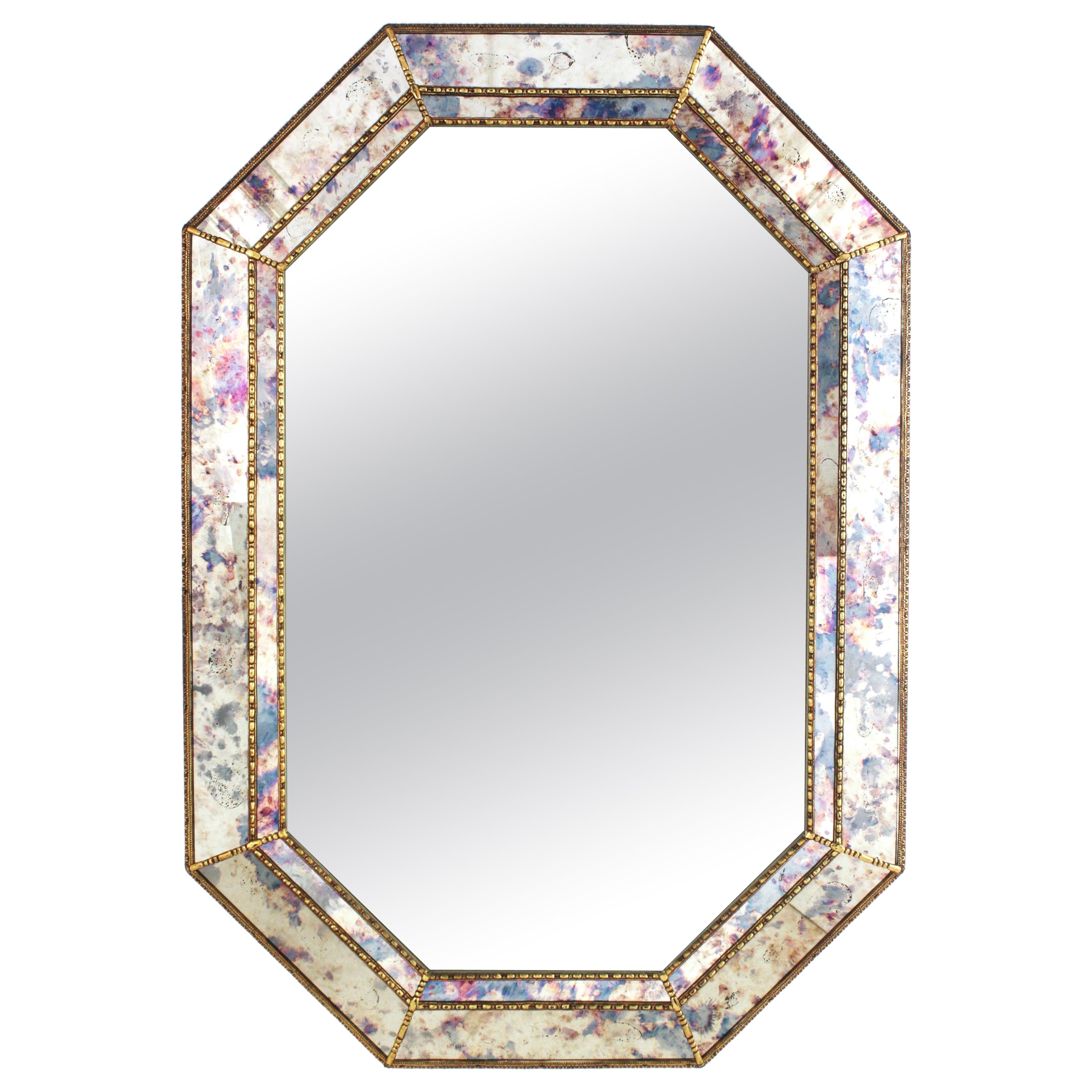 Specchio ottagonale moderno veneziano con vetro rosa e viola e dettagli in ottone