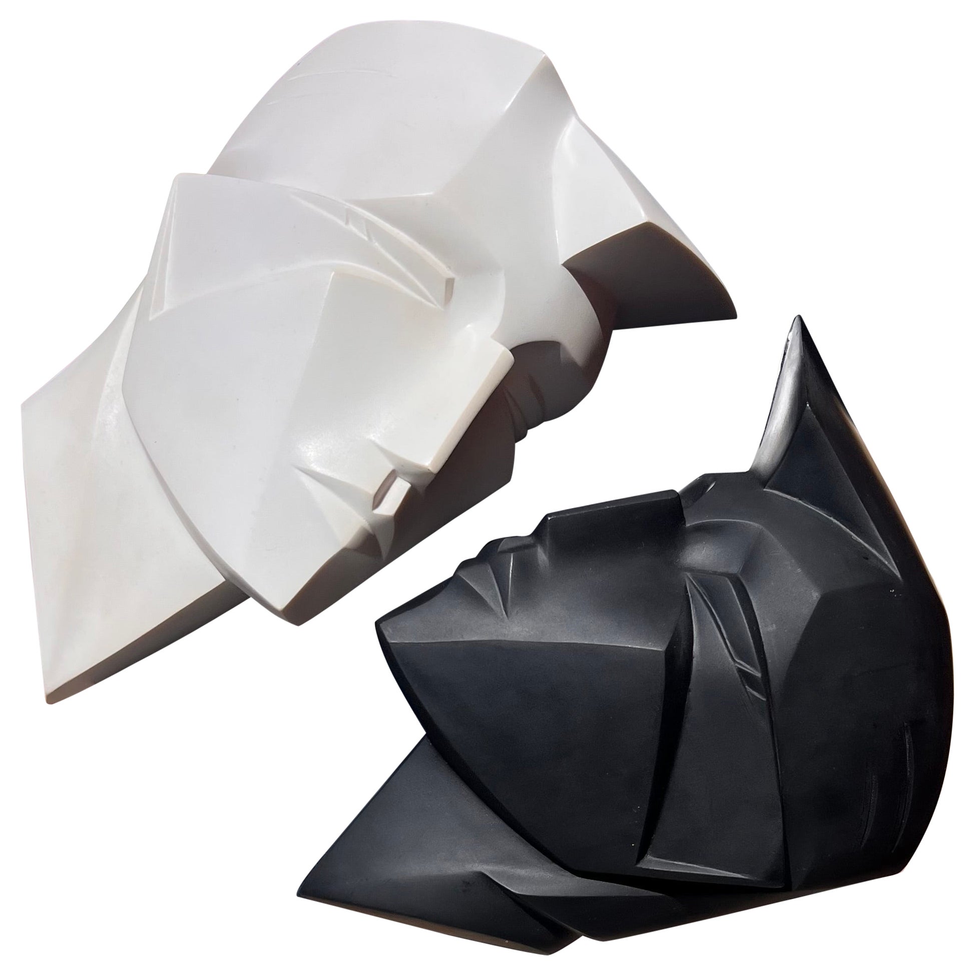 A pair of face sculptured by Lindsey B., signed, 1986 For Sale