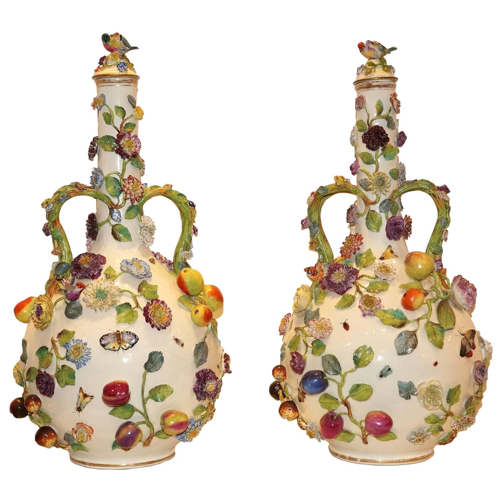 Pair of Continental Porcelain Bottle Form Vases with applied Fruits and Flowers