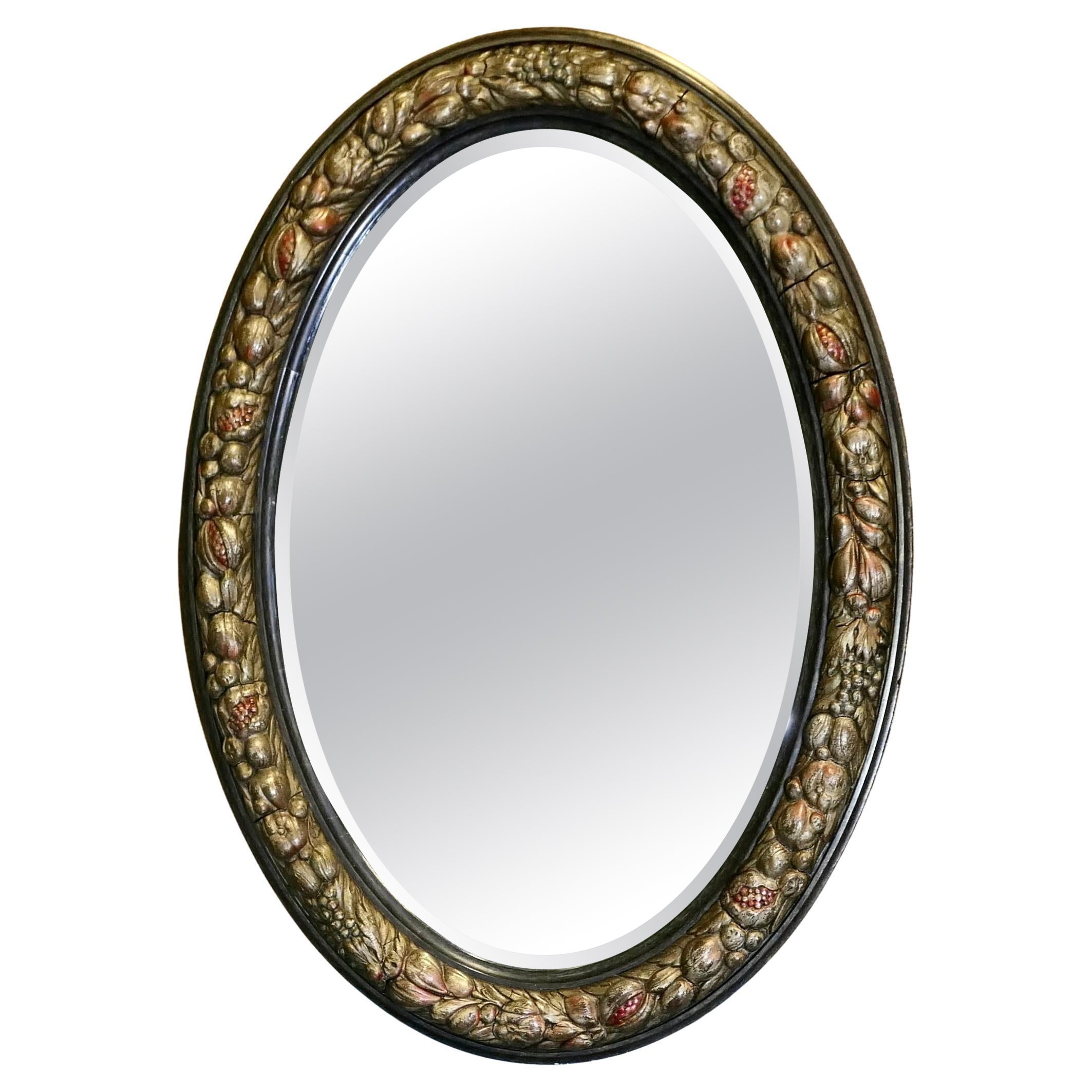 Grand miroir ovale en gesso décoré de fruits en vente