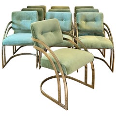 Un ensemble de 10 chaises de salle à manger en porte-à-faux en laiton plaqué  vers les années 1970