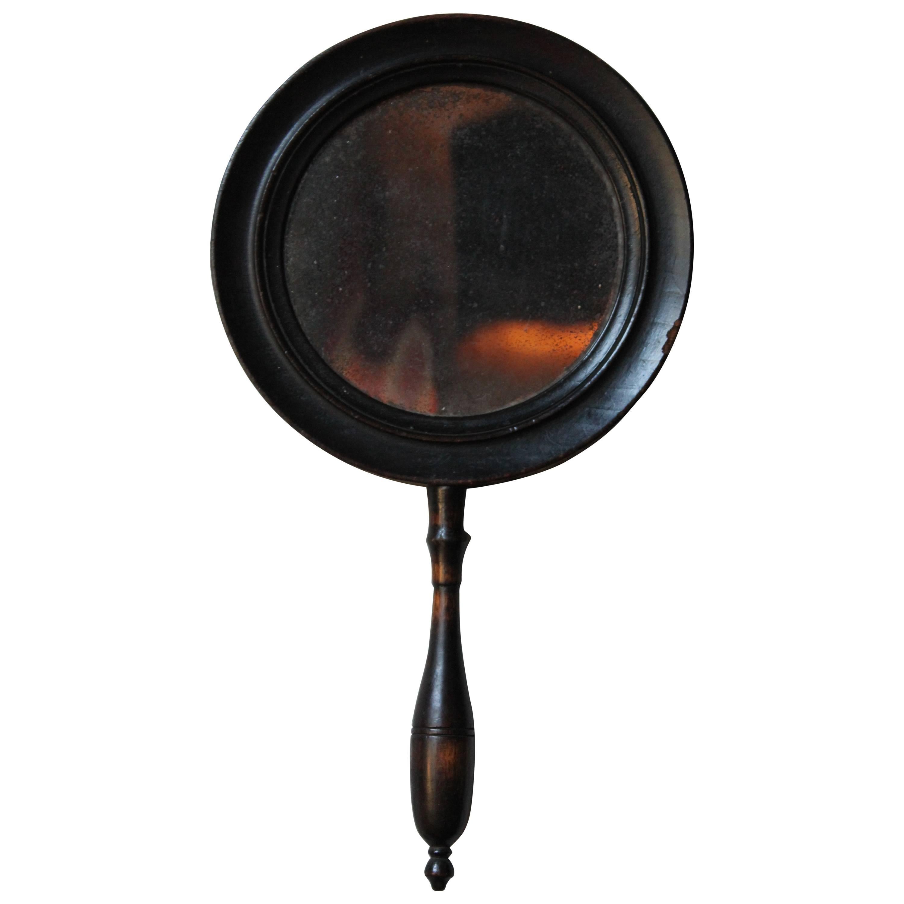 Rare 18th century Ebonized Convex/Concave Hand Mirror, circa 1790