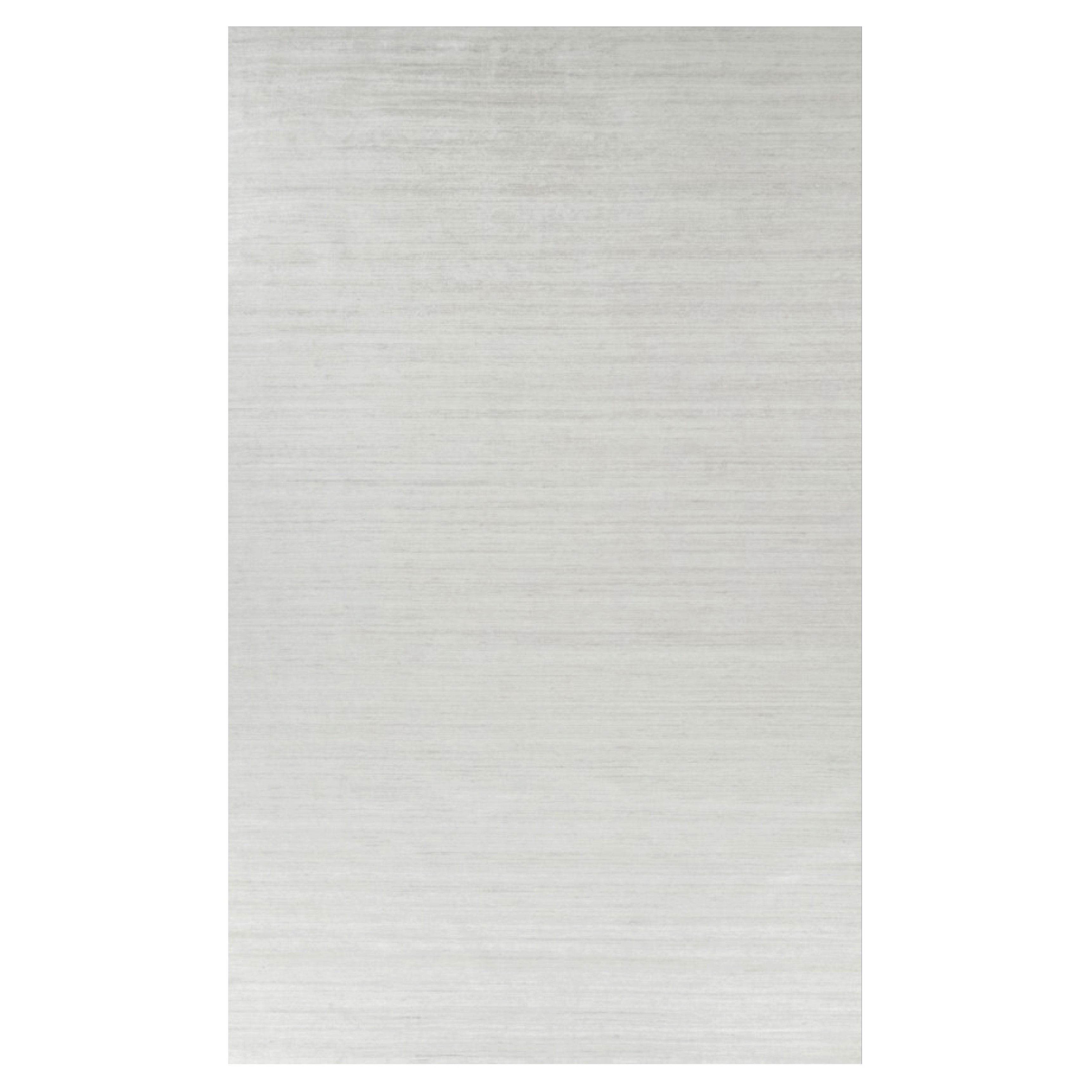 Rug & Kilim’s Oversized Textural Rug In Solid White, Gray and Cream Striae
