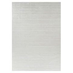 Rug & Kilim’s Oversized Textural Rug In Solid White, Gray and Cream Striae