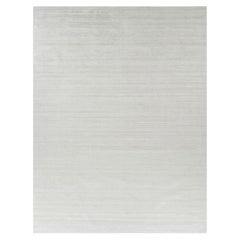 Rug & Kilim’s Oversized Textural Rug In Solid White, Gray and Cream Striae