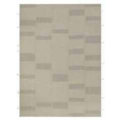 Rug & Kilim è un kilim contemporaneo a strisce beige e marroni.