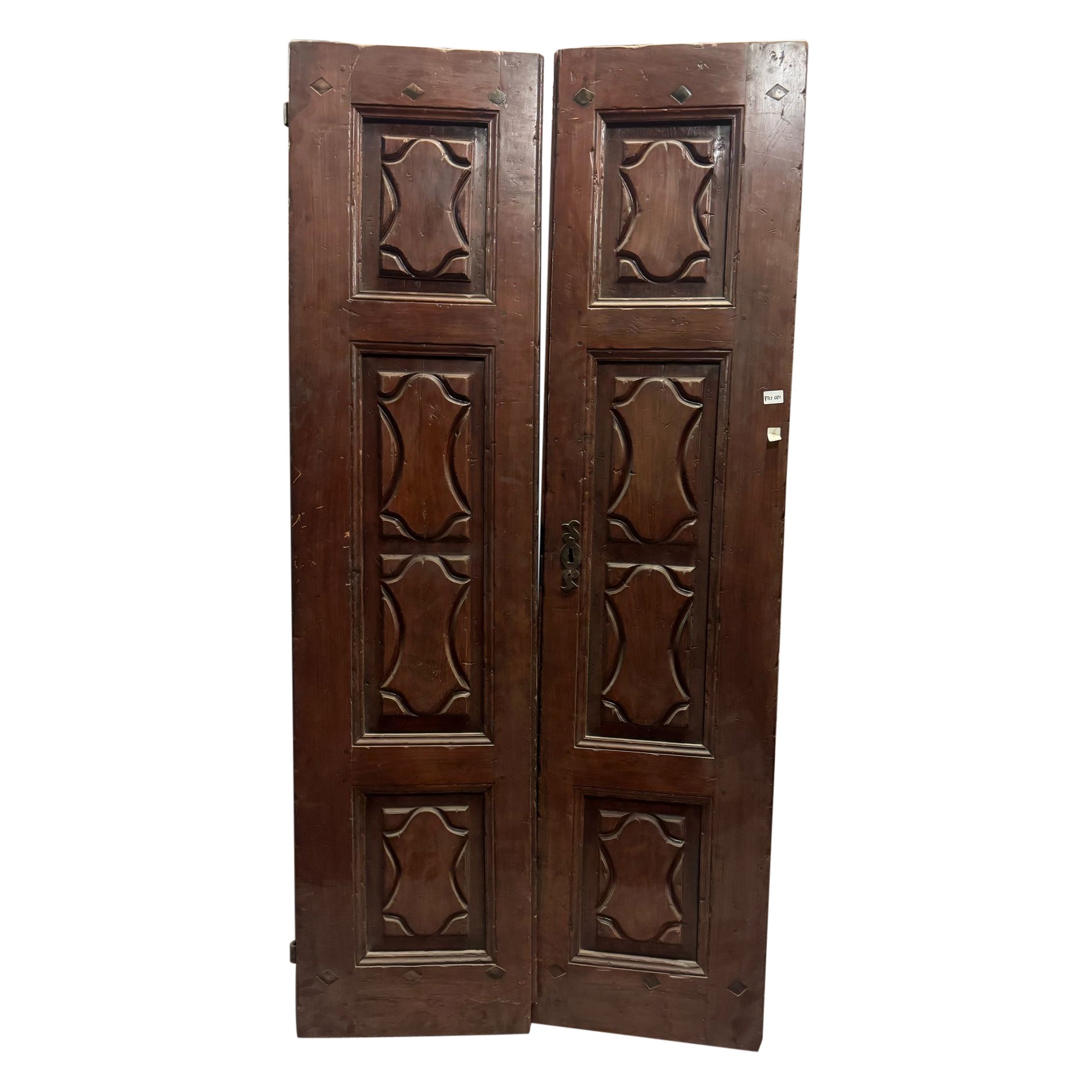 Entrance door in walnut wood, with two solid leaves, Italy