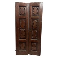 Entrance door in walnut wood, with two solid leaves, Italy