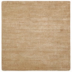 Muestra de alfombras personalizadas con textura de Rug & Kilim en tonos beige, topo y blanco crema