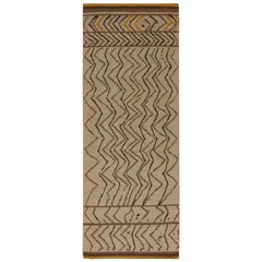 Rug & Kilim’s Moroccan Style Rug in Beige-Brown Chevrons with Gold Accents