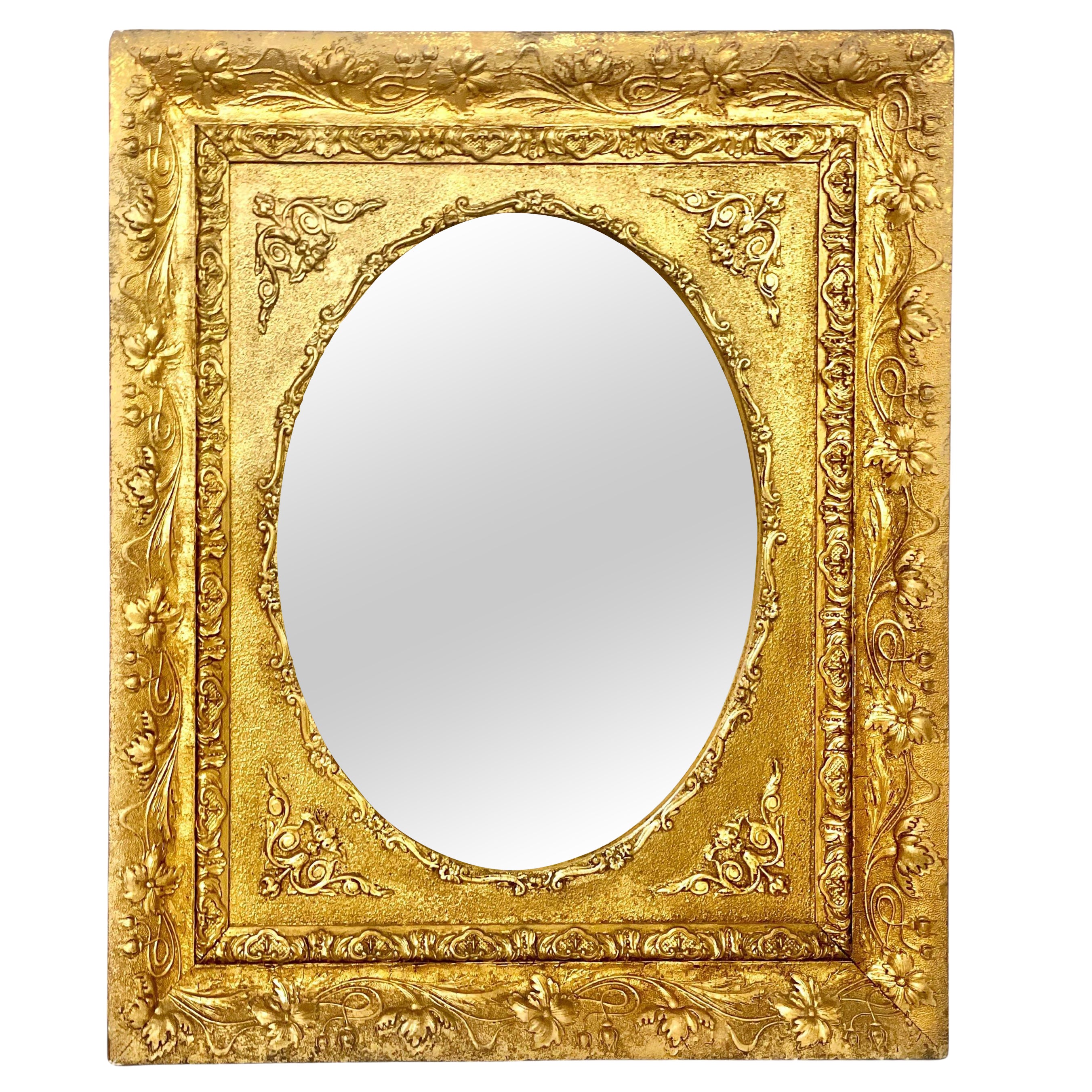Miroir Médaillon mural avec cadre floral doré et orné