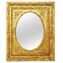 Miroir Médaillon mural avec cadre floral doré et orné