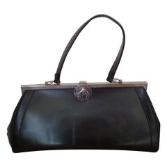 Sac à main en cuir brun foncé avec fermoir à rabat par R. Cochet