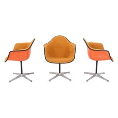 1975 Set of Three Herman Miller Eames Arm Shell Chairs PAC w/ Red/Orange Shells