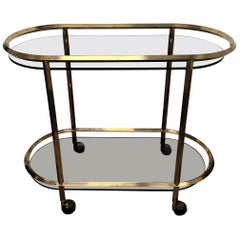 Carrello da bar italiano del 1960 a due piani in ottone e vetro con piano in vetro scuro