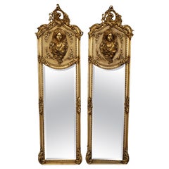 Pair of Gold French Rococo Louis XVI Style Figural Tall Narrow Beveled Mirrors
