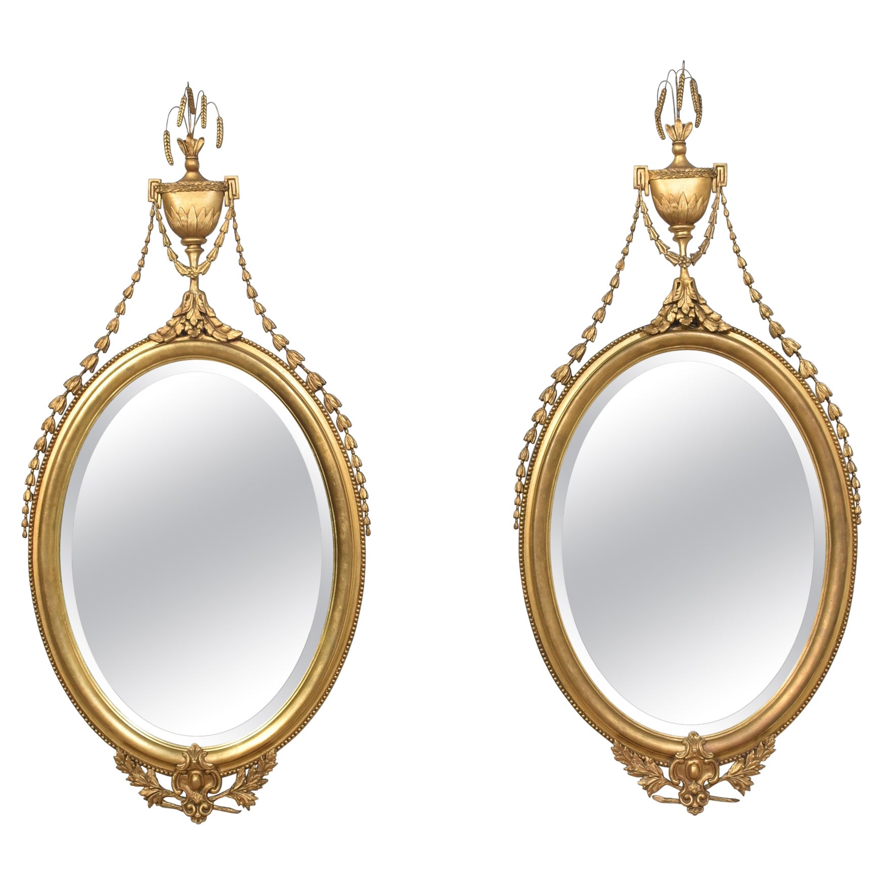 Pair of large oval wall mirrors