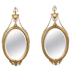 Antique Pair of large oval wall mirrors