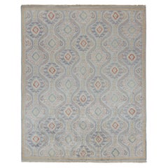 Alfombra de estilo ikats clásico de Rug & Kilim con motivos azul, dorado y rojo óxido