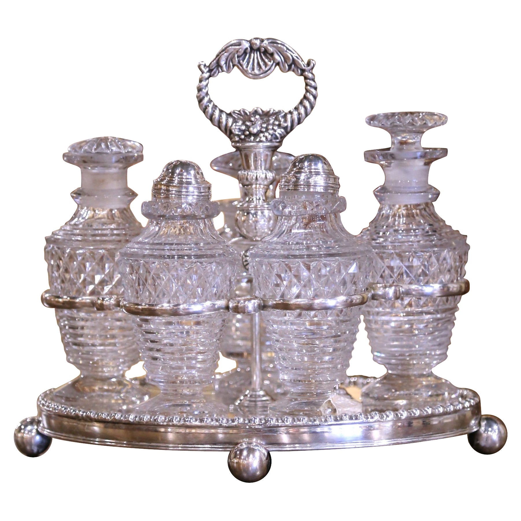 Juego victoriano inglés de plata y cristal de cinco piezas del siglo XIX