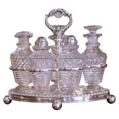Juego victoriano inglés de plata y cristal de cinco piezas del siglo XIX