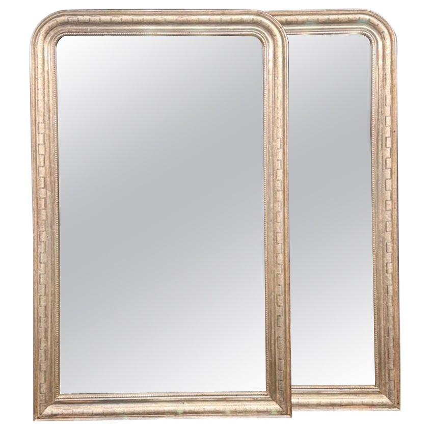 Coppia di specchi Louis Philippe in argento con motivo geometrico