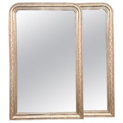Paire de miroirs Louis Philippe argentés à motif géométrique
