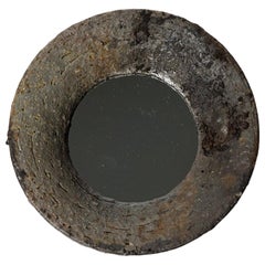 Wood fired ceramic mirror by Mia Jensen, 2025.