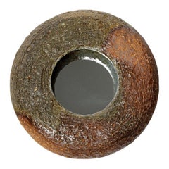 Wood fired ceramic mirror by Mia Jensen, 2025.